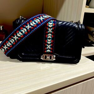 Rebecca Minkoff camera style bag with matching guitar strap.